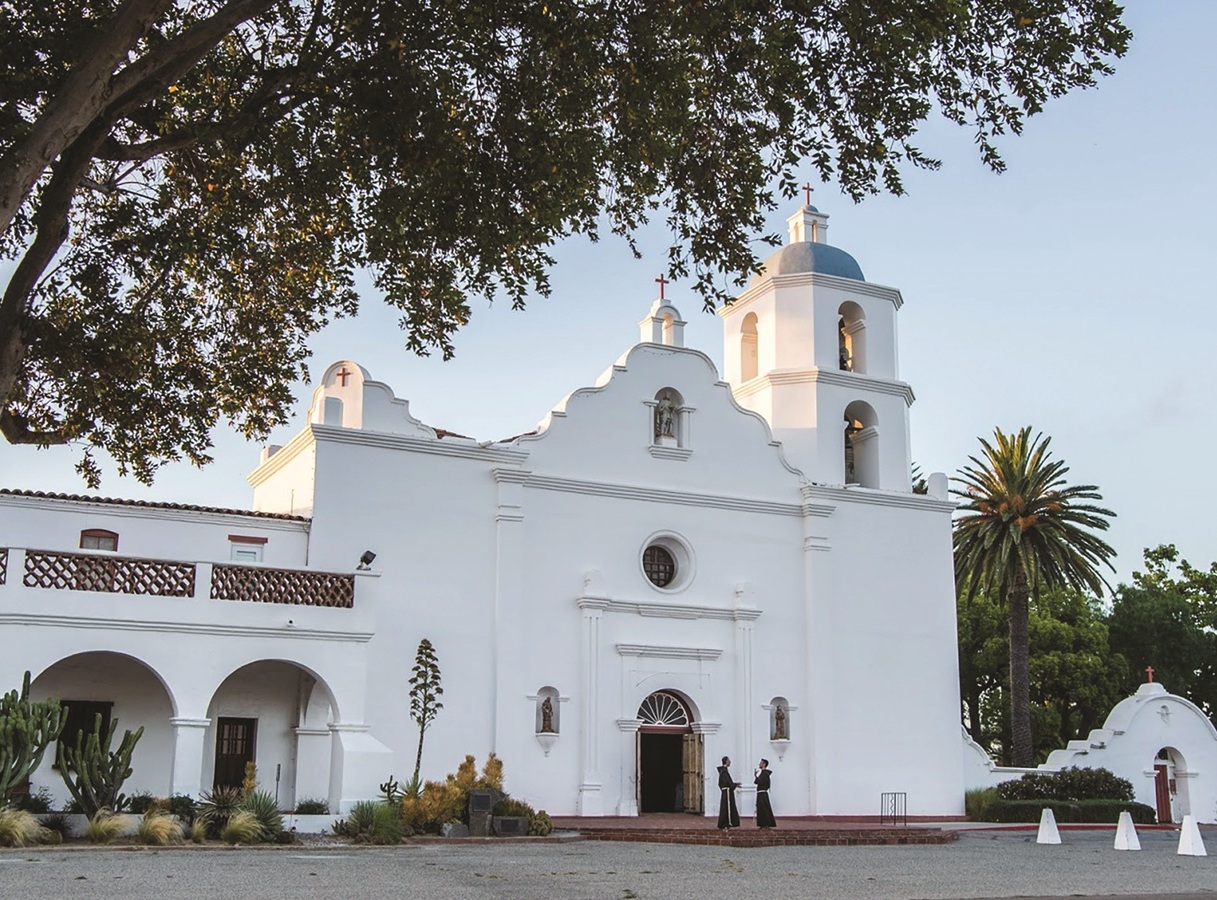Franciscans in front of mission church MSLR